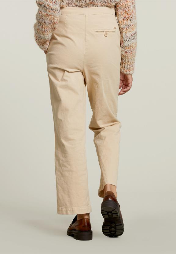 Pantalon taille haute beige avec poches passepoilées